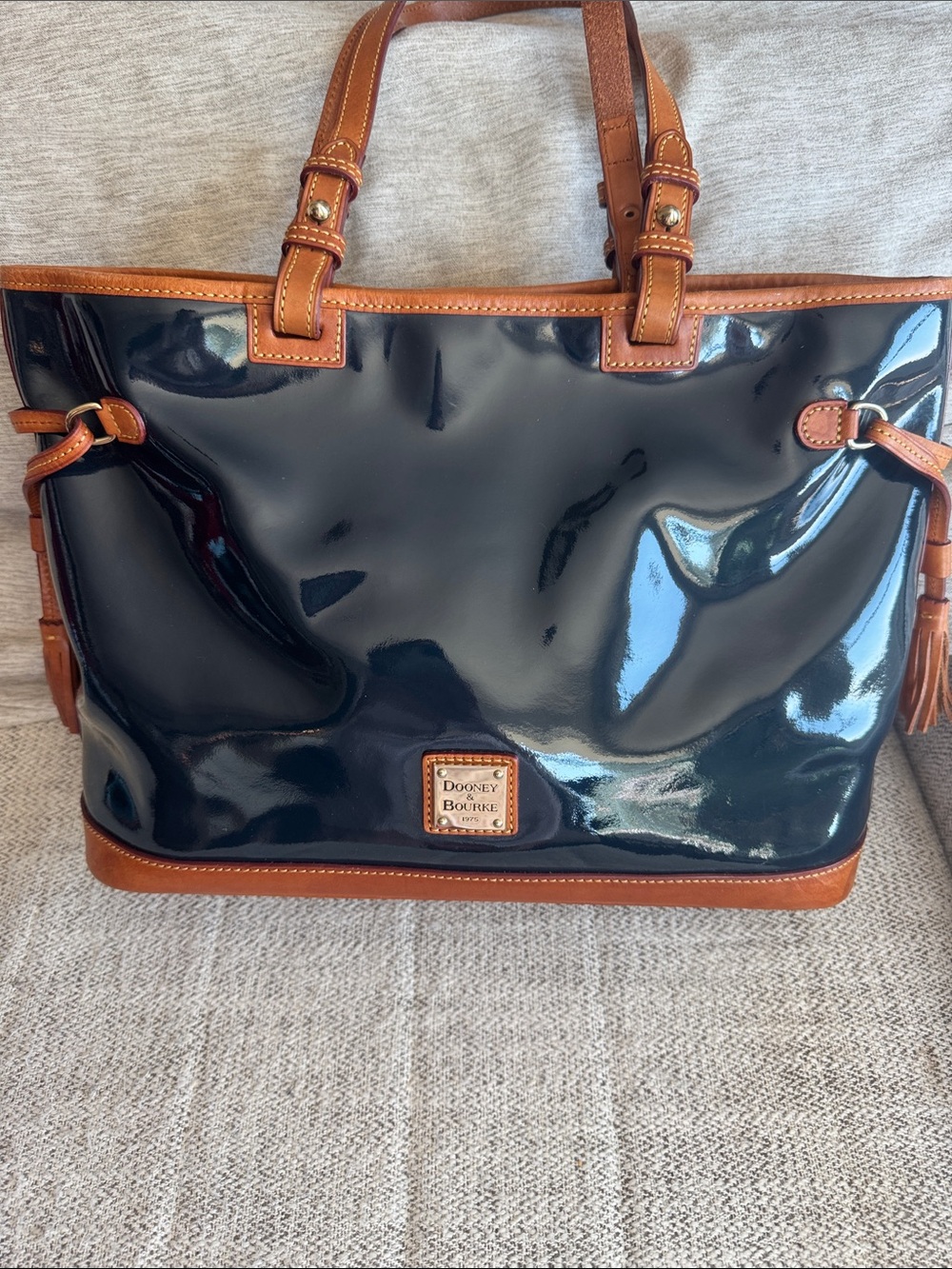 Dooney & Bourke Black/Deep Navy Patent Leather Shopper Tote and Tassel Accents